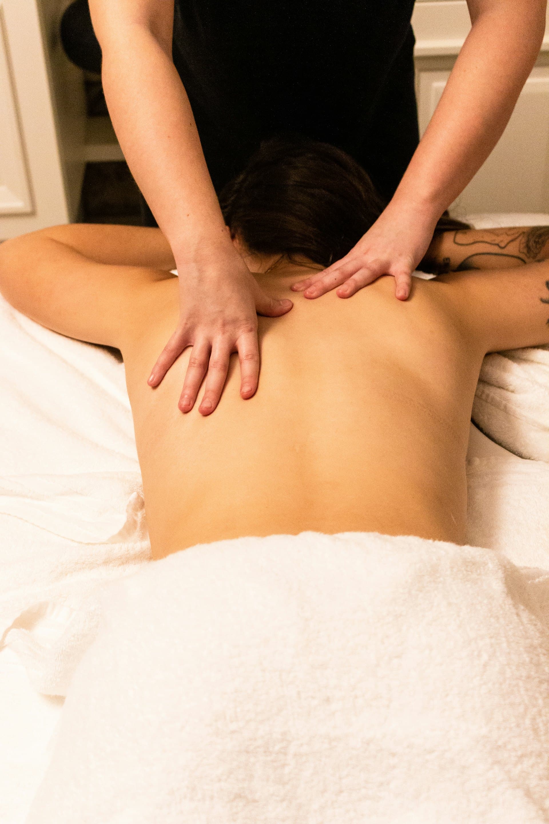 Deep, grounding back massage during a treatment